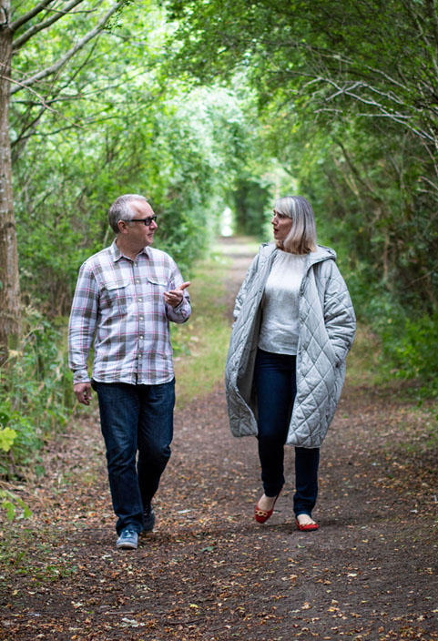 Mark Evans and colleague walking in woods